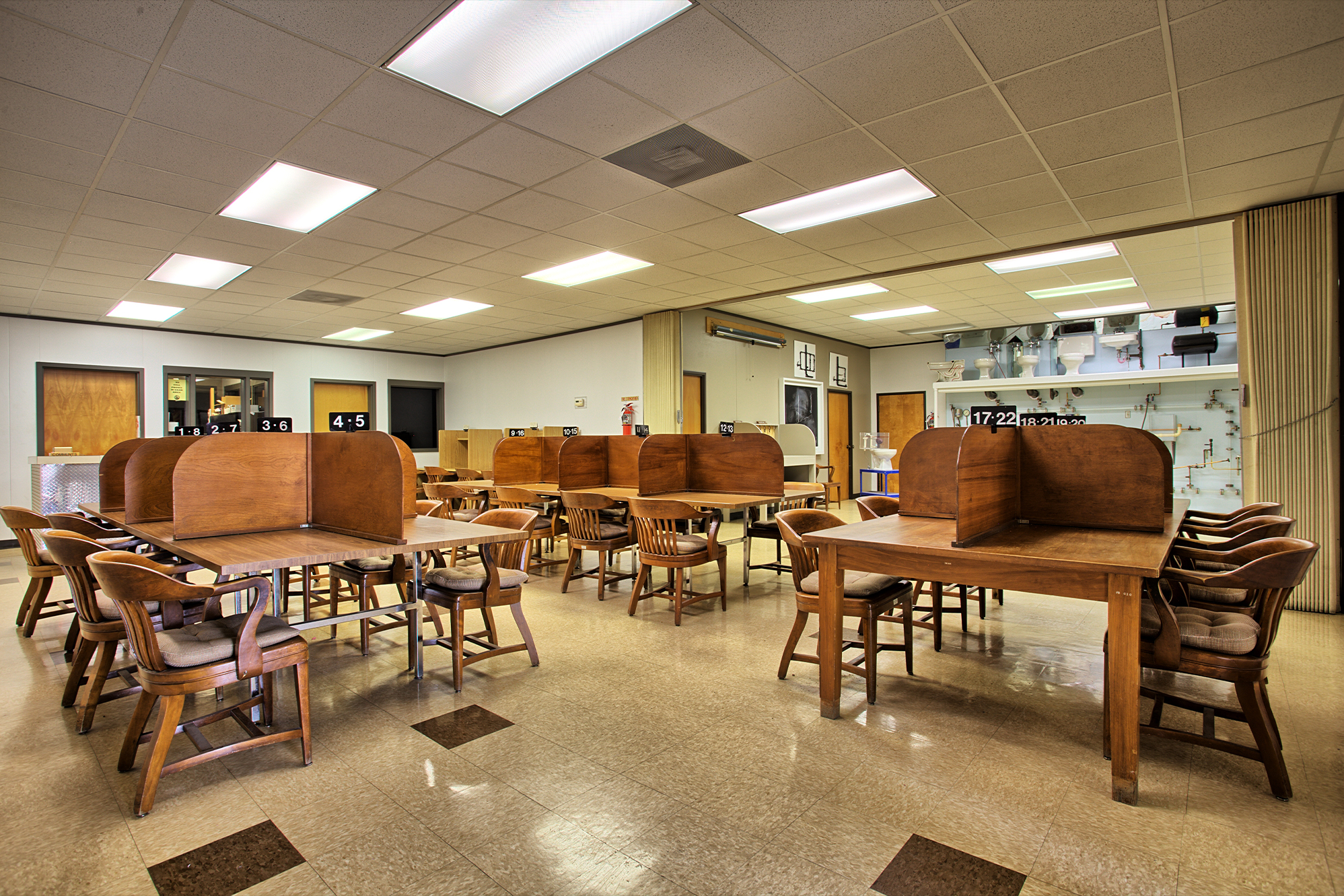 Empty desks in TSBPE Exam Center.